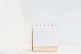 a calendar sitting on top of a table by Blessing Ri courtesy of Unsplash.