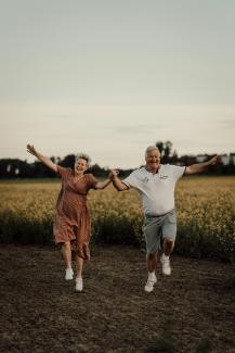 a man and woman jumping in the air by Isak Pettersson courtesy of Unsplash.