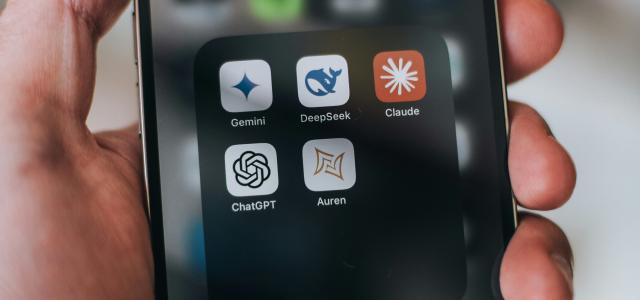 Hand holding a phone with ai application icons. by Aerps.com courtesy of Unsplash.